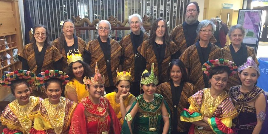 Group photo of gamelan performers and dancers all in uniform