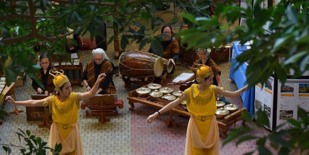 Overhead shot of dancers in front of the sitting Gamelan performers